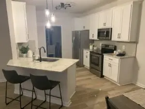 White shaker with veined quartz countertops in Greenville, SC